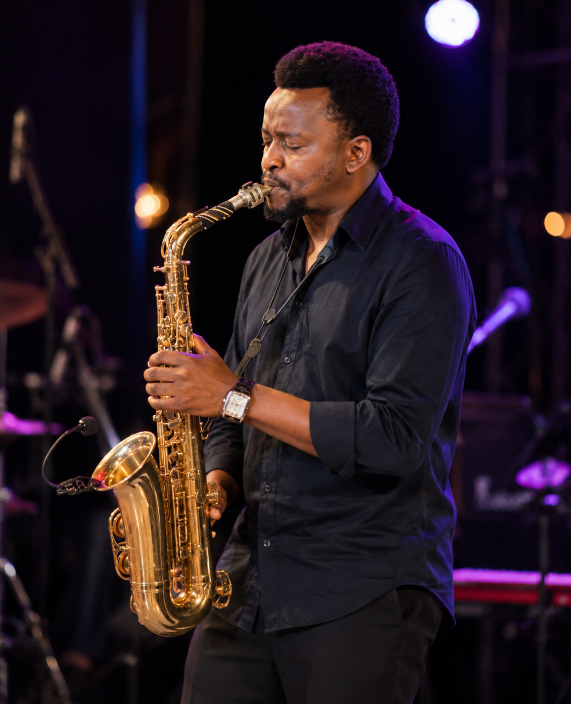 Lee performing saxophone live on stage